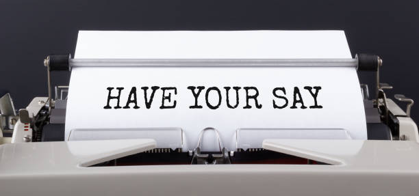 istock Text HAVE YOUR SAY typed on typewriter, close up. 1290203555
