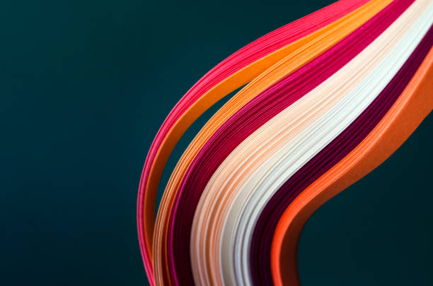 istock Abstract dark green background with bright stripes in orange-brown tones. 1290211602