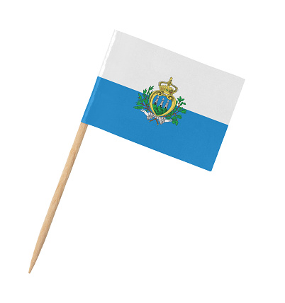 Small paper flag of San Marino on wooden stick, isolated on white