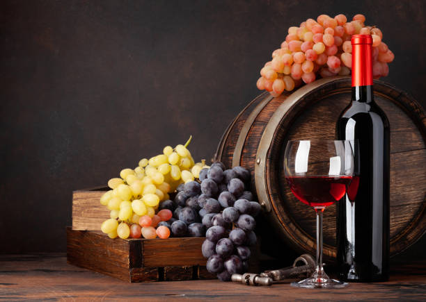 istock Wine bottle, grapes, glass of wine 1290222578