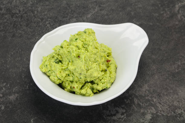 istock Avocado guacamole sauce with chili pepper 1290222940