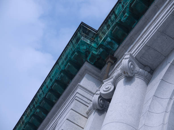 istock Old building architectural details with classic columns chapiter, bronze cornice decoration with patina 1290223626