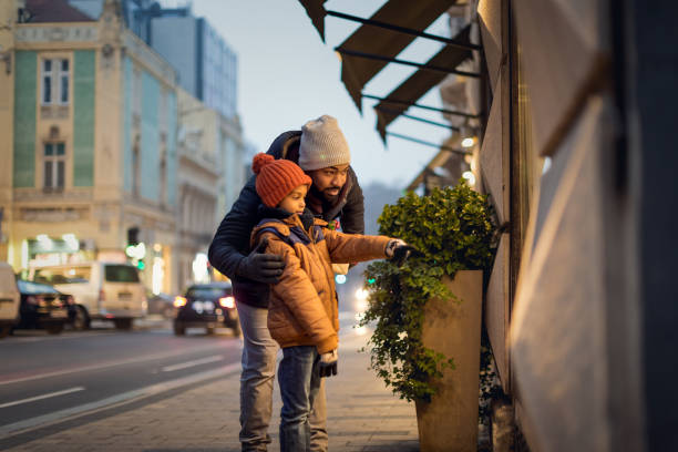 istock Father and son in Christmas shopping 1290224828