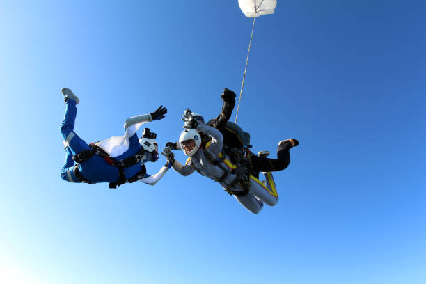 istock Skydiving. Tandem jump and cameraman. 1290224928