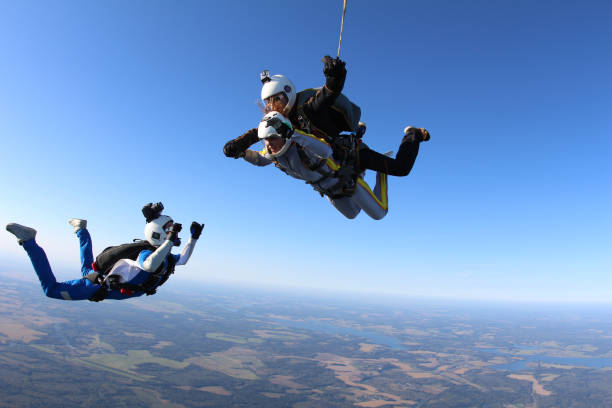istock Skydiving. Tandem jump and cameraman. 1290224960