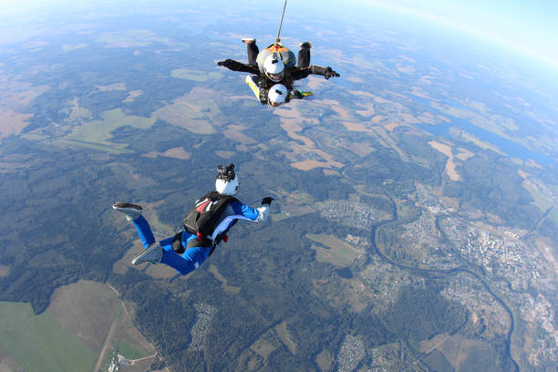 istock Skydiving. Tandem jump and cameraman. 1290224976