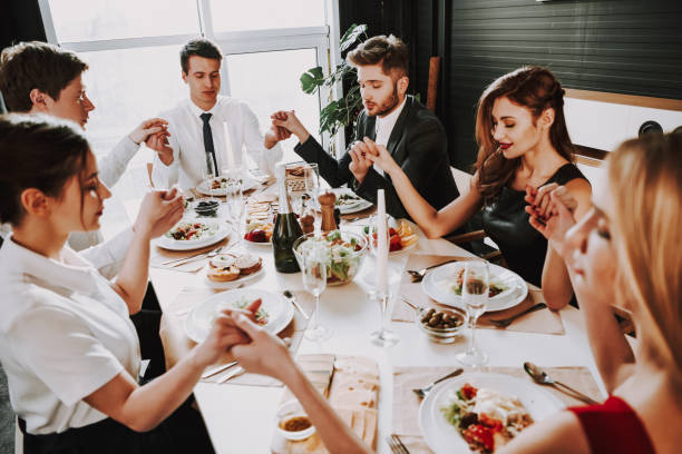 istock Group of friends at dinner table at home. 1290225123
