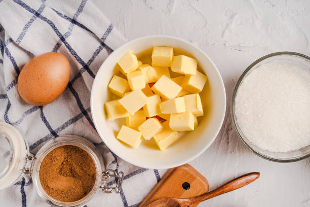istock Butter diced in a baking bowl on a marble white table 1290225313