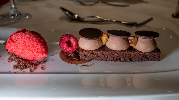 istock Chocolate cake with raspberry, hazelnut and ice cream. Delicious dessert. 1290225411