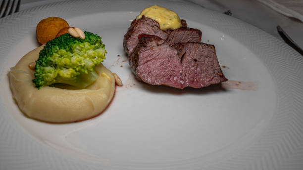istock Grilled steak with vegetables on white plate. 1290225412