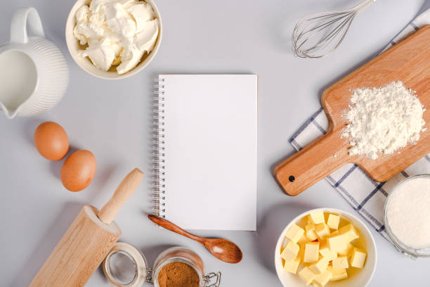 istock Top view of an empty notepad for writing down a recipe and various ingredients for baking pastry and kitchen tools 1290226653