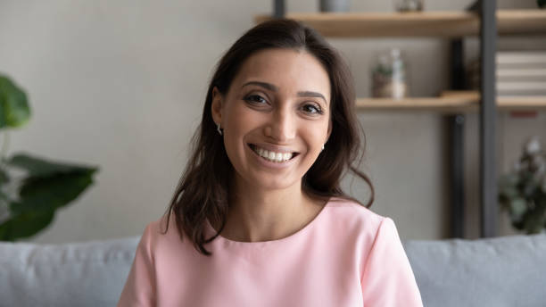 istock Smiling mixed race arab indian woman looking at camera. 1290228378