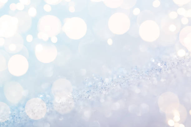 istock Shiny silver defocused glitter background with golden lights 1290228614
