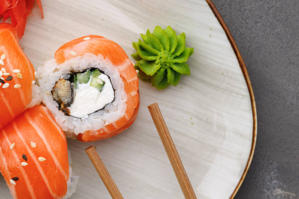 istock Philadelphia sushi roll on plate close up 1290229873