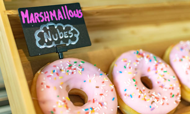 istock Marshmallow flavoured ring donut on a shelf 1290232082