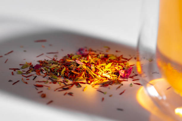 istock Colorful dry tea herbs heap on white surface 1290232338