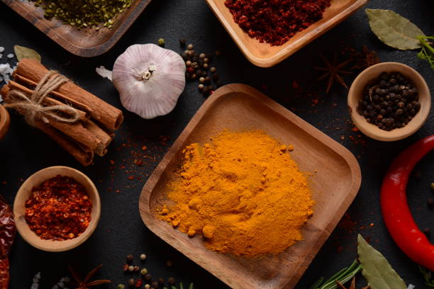 istock Colorful various herbs and spices for cooking on dark background 1290233286