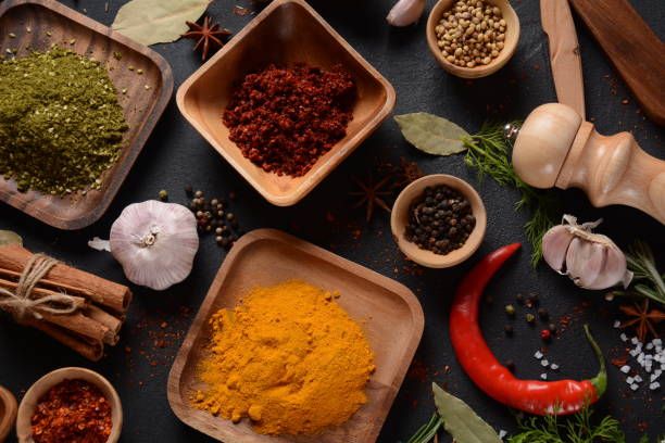 istock Colorful various herbs and spices for cooking on dark background 1290233369