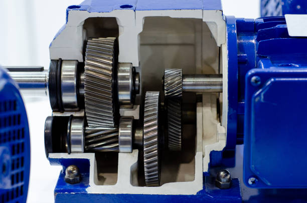 Close-up of cross-section helical gearbox with motor Close-up of cross-section helical gearbox with motor helical stock pictures, royalty-free photos & images