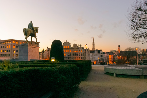 Sunset over the city center of Brussels seen from Mont des Arts hill, with the tower of the Brussels town hall in the middle. Brussels is the capital of Belgium.