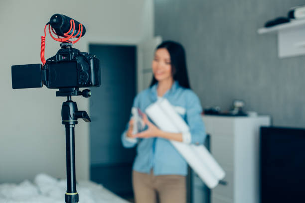 istock Confident professional speaker recording informative video at home 1290237532