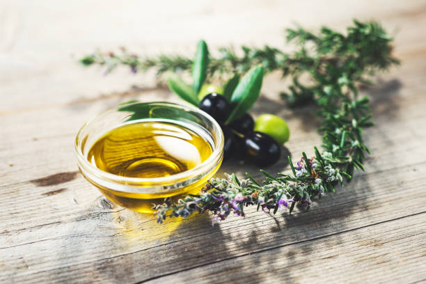 istock Olive oil with leaves and olives 1290238511