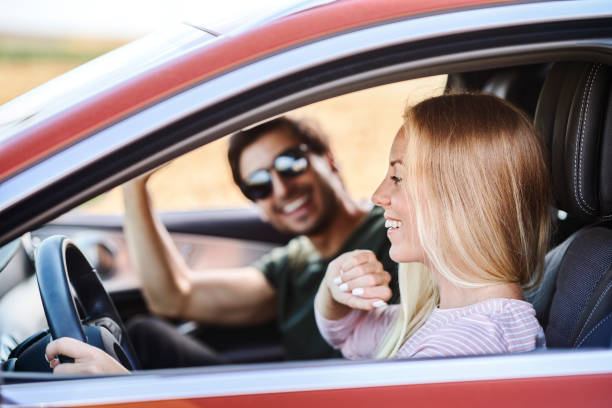 istock Couple driving in the car 1290238828