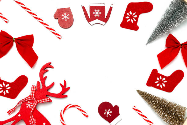 istock Christmas background. Stocking, gifts, winter tree, ribbon and bow in shape frame on white background for greeting card. Winter festive composition with copy space. 1290241381