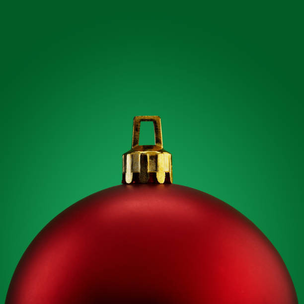istock Red Christmas ball on green background 1290241926