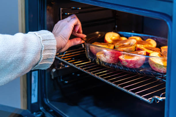 istock glass container with sliced stuffed apples in the oven, close-up 1290241933