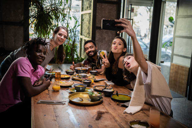 istock Friends taking selfies in a cafe during a dinner party 1290243284