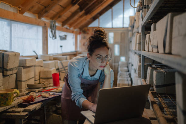 istock Female entrepreneur in her pottery sculpting studio 1290248690