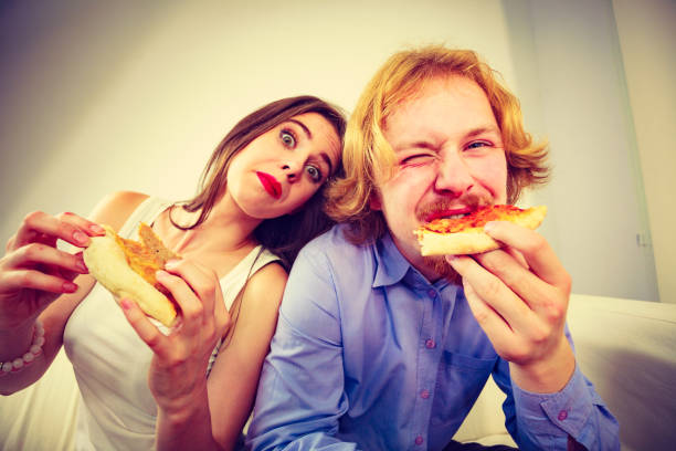 istock Couple eating pizza 1290248811