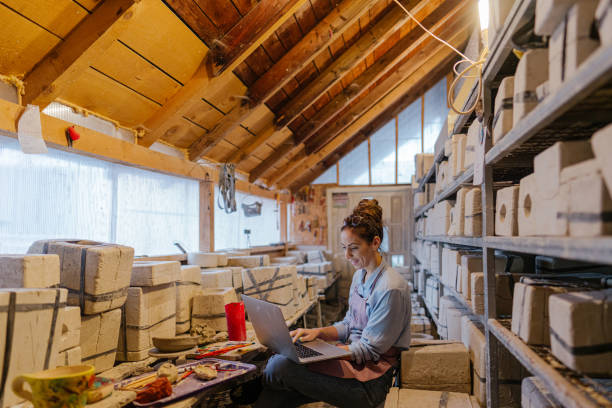 istock Female entrepreneur in her pottery sculpting studio 1290248961