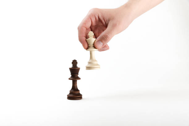 istock Battle of chess kings on white background 1290249160