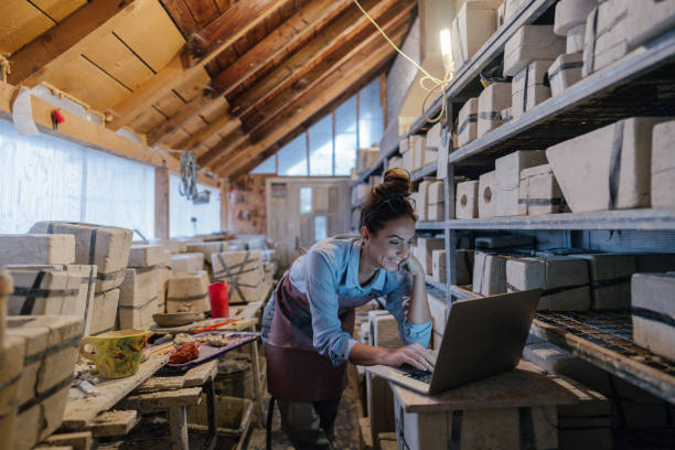 istock Female entrepreneur in her pottery sculpting studio 1290249239