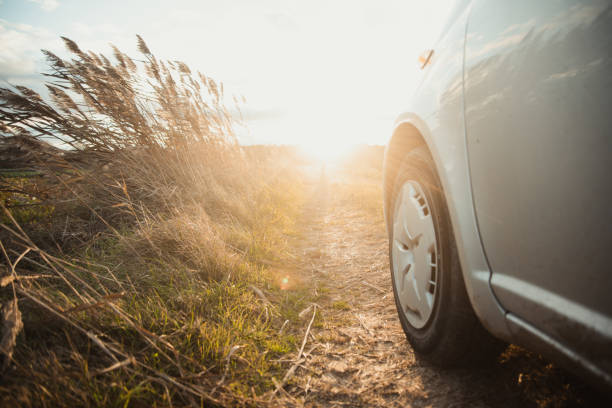 istock Countryside road and car 1290249468