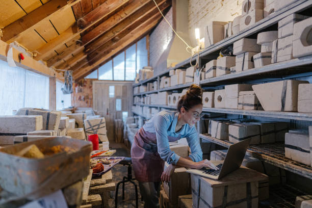 istock Female entrepreneur in her pottery sculpting studio 1290251790