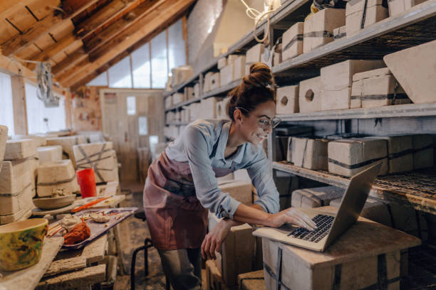 istock Female entrepreneur in her pottery sculpting studio 1290251888