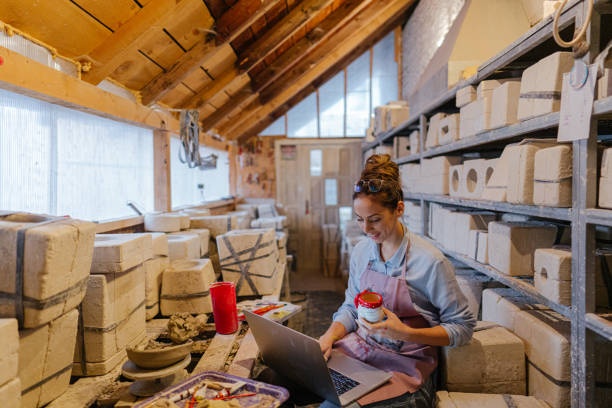istock Female entrepreneur in her pottery sculpting studio 1290252009