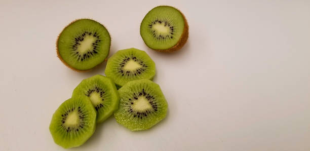istock Kiwi fruit slices and halves. 1290252184