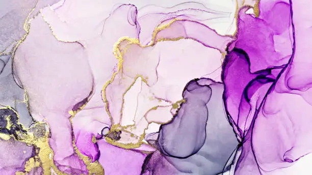 Photo of Closeup of purple and shiny golden alcohol ink abstract texture, trendy wallpaper