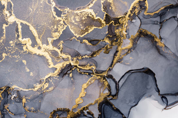 istock Grey and shiny golden alcohol ink abstract texture, trendy wallpaper 1290253476