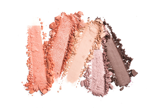 Broken bright color eyeshadow as samples of cosmetic beauty products