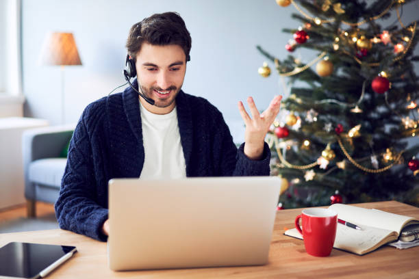 istock Young teleworker working from home during Christmas 1290254396