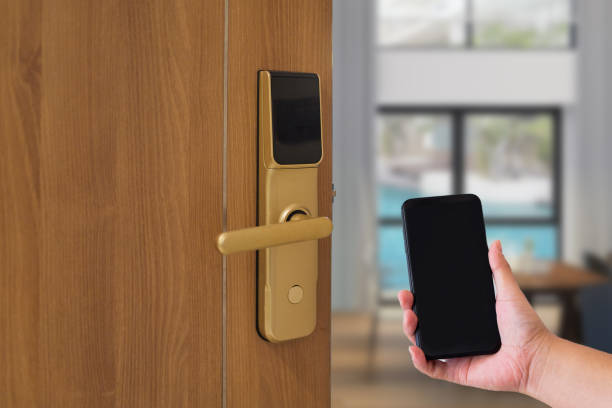 istock Hotel door security Unlocking by application on mobile phone 1290257916