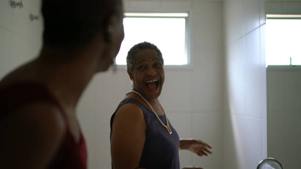 istock Mother and daughter dancing in the bathroom 1290258343
