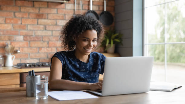 istock Happy young african ethnicity multiracial businesswoman working on computer. 1290259695