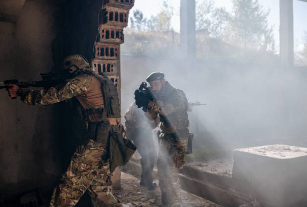 istock Group of soldiers in attacking position. 1290260057