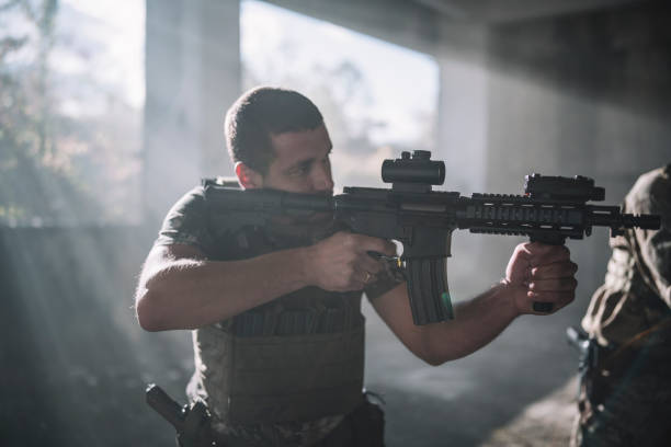 istock Portrait of soldier in combat position. 1290260064